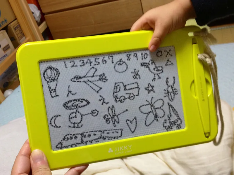 A magic drawing slate (JIKKY) with drawings